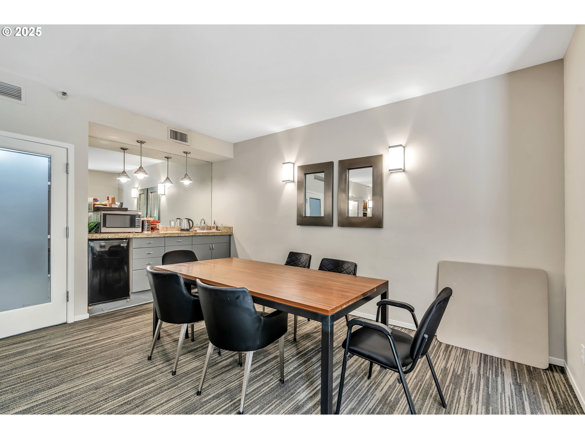 1500 Southwest Park Avenue, Unit 232 Portland, OR 97201 - Photo 23 of 40 a view of a dining room with furniture and wooden floor