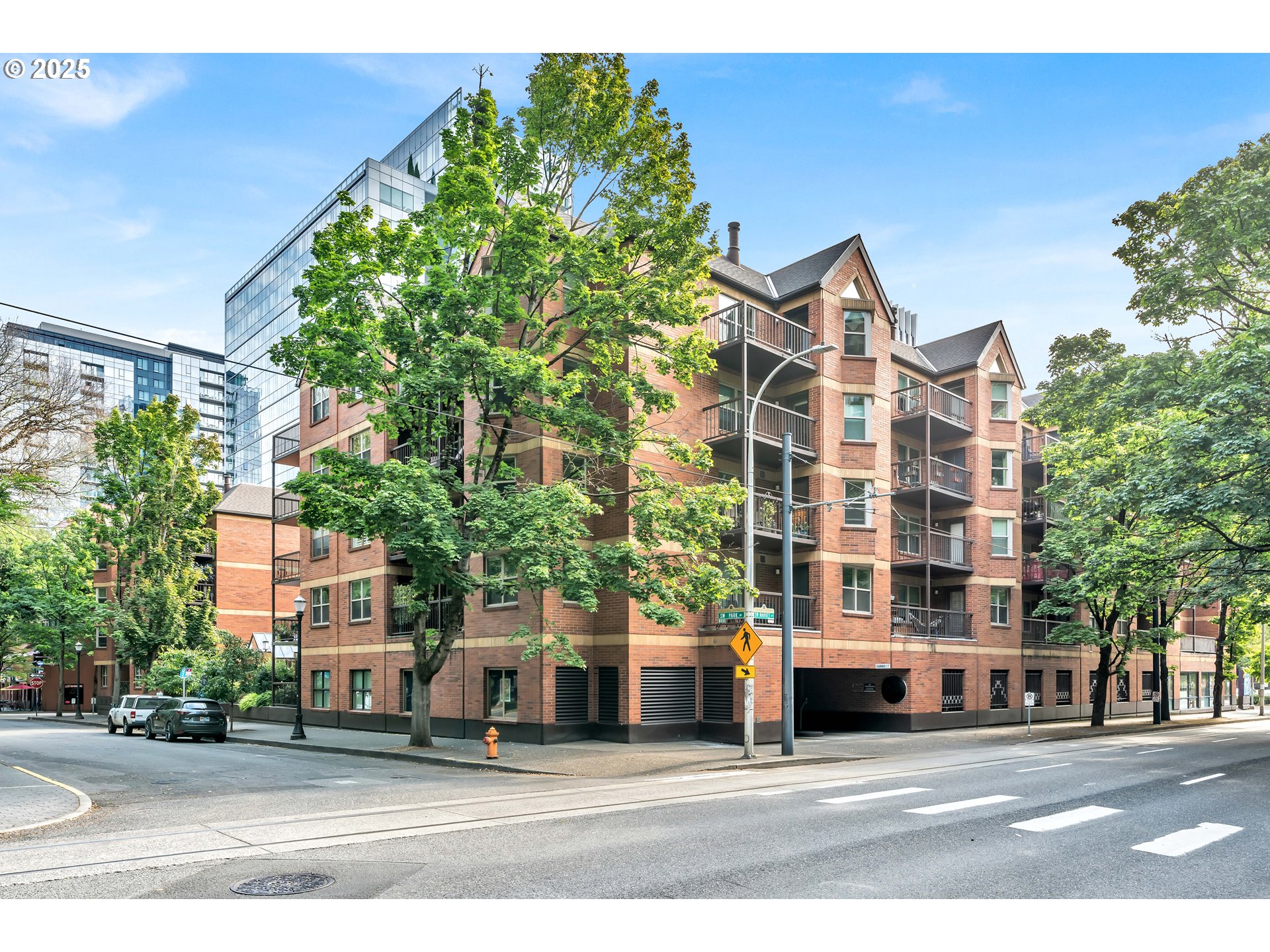 1500 Southwest Park Avenue, Unit 232 Portland, OR 97201 - Photo 33 of 40 a city street lined with buildings and trees