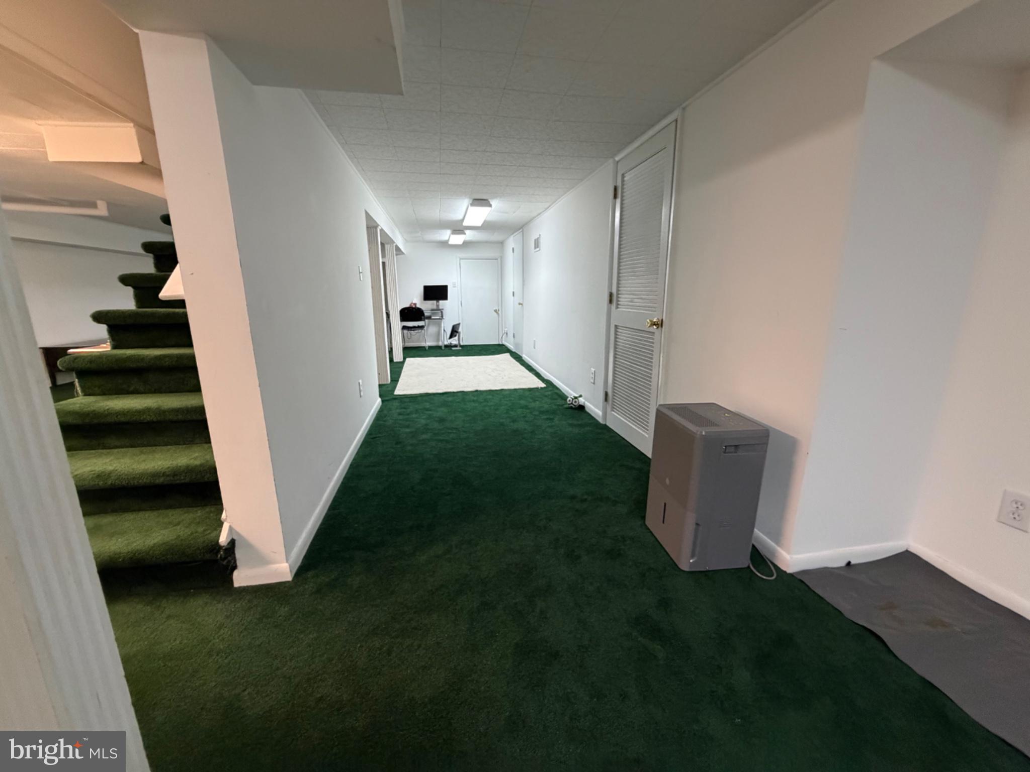 321 Surrey Road Cherry Hill, NJ 08002 - Photo 22 of 24 a view of a hallway to an empty room with stairs