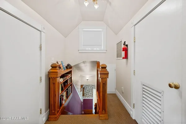 a view of storage and utility room with closet