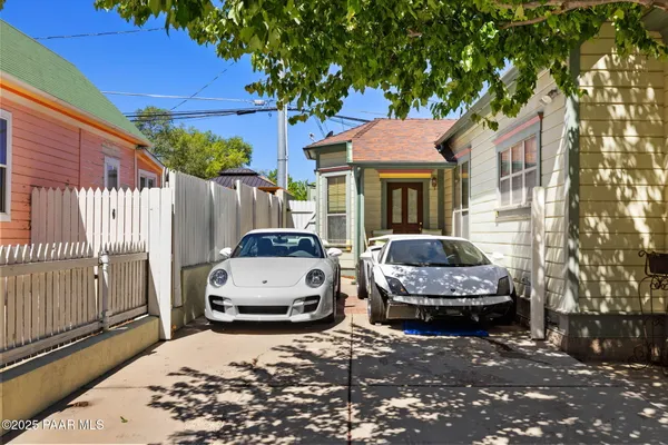 a view of a car park in front of a house