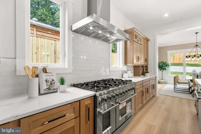 a large kitchen with lots of counter space and sink