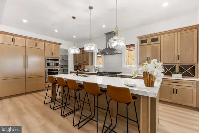 a dining room with furniture and chandelier