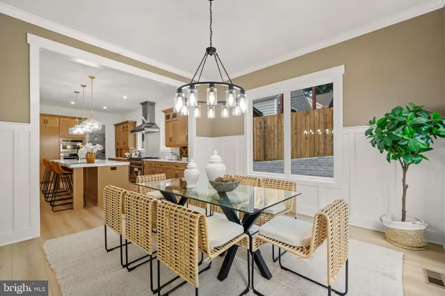 a dining room with furniture window and outside view