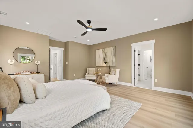 a living room with furniture and mirror