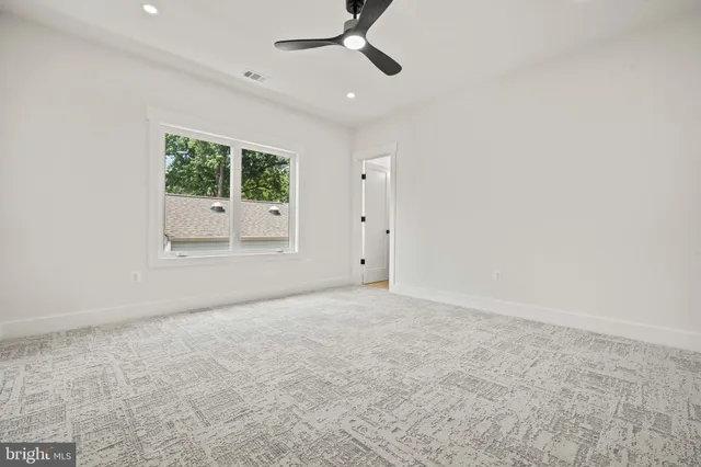 a kitchen with stainless steel appliances white cabinets and a sink