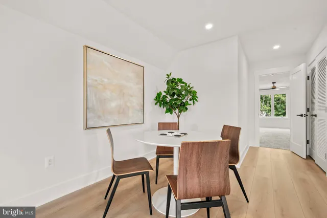 a bathroom with a sink a toilet a mirror and vanity