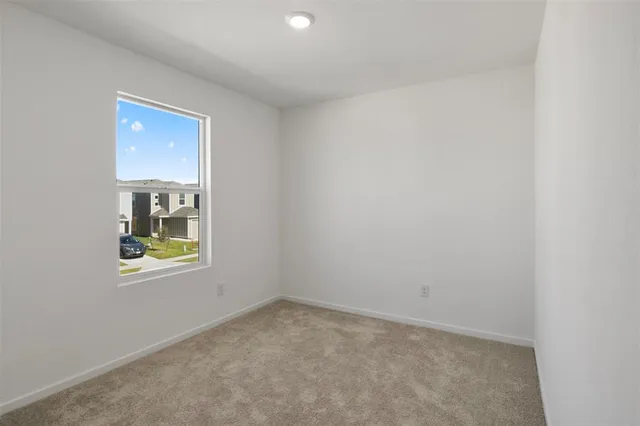 an empty room that has a window