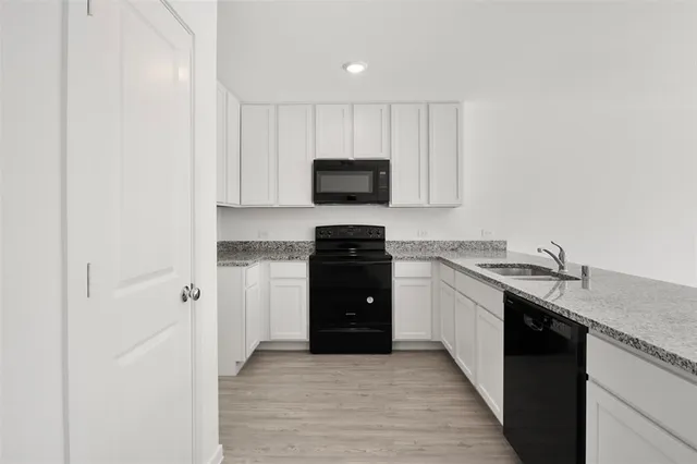 a view of kitchen with wooden floor