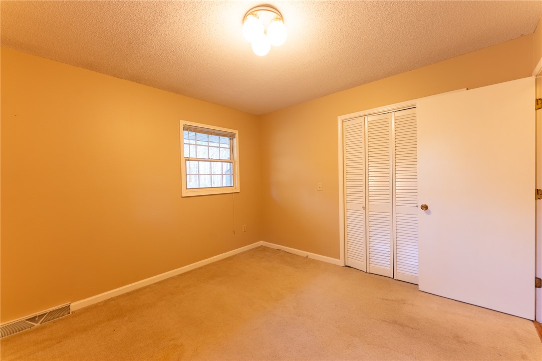 139 Todds Creek Road Central, SC 29630 - Photo 23 of 45 This spacious bedroom offers ample natural light, creating a bright and inviting atmosphere.