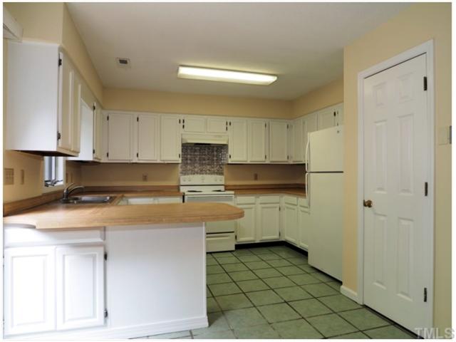 4300 Hunters Club Drive Raleigh, NC 27606 - Photo 5 of 19 Very Large Kitchen! Refrigerator Stays! New Paint through out! New Backsplash! Breakfast Bar!