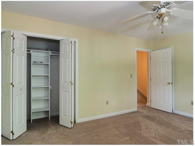 4300 Hunters Club Drive Raleigh, NC 27606 - Photo 9 of 19 Upstairs Bedroom with Ceiling Fan and Closet Organizer! Everything has been Freshly Painted and New Carpet just waiting for you.
