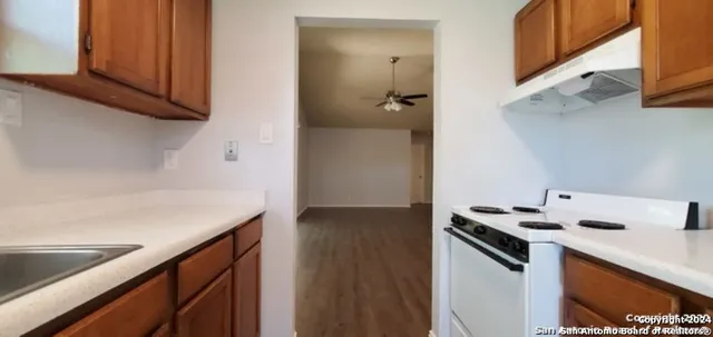 a kitchen with a stove and a microwave