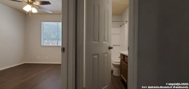 a view of an entryway with wooden floor