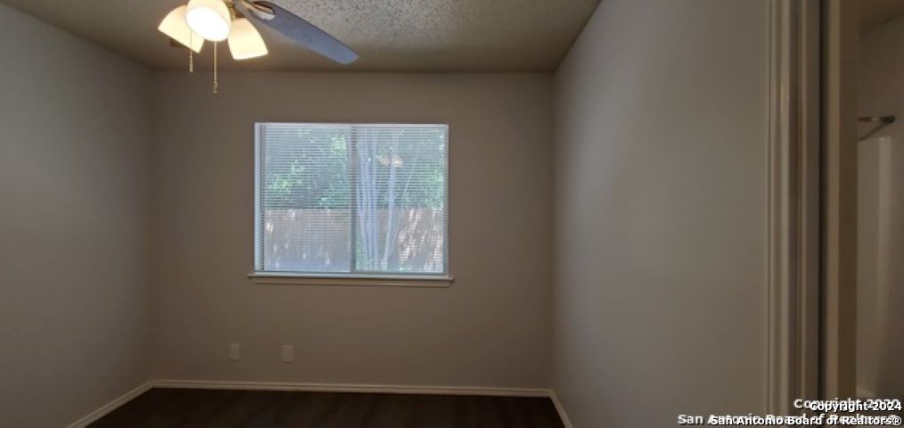 5236 Meadow Rise Street San Antonio, TX 78250 - Photo 18 of 25 a view of an empty room with a window