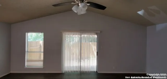 a view of an empty room with a window