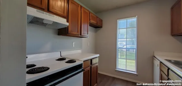 a kitchen with a stove and a microwave
