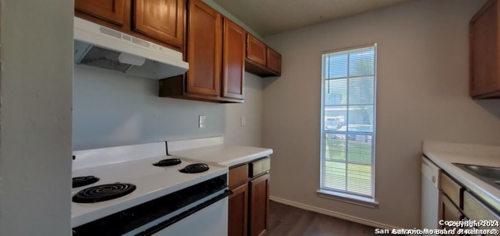 5236 Meadow Rise Street San Antonio, TX 78250 - Photo 9 of 25 a kitchen with a stove and a microwave