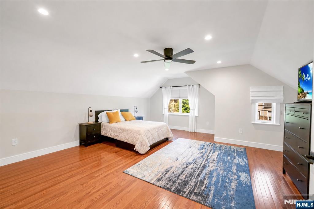 433 Piermont Road Cresskill, NJ 07626 - Photo 29 of 49 a bedroom with a bed and a flat screen tv