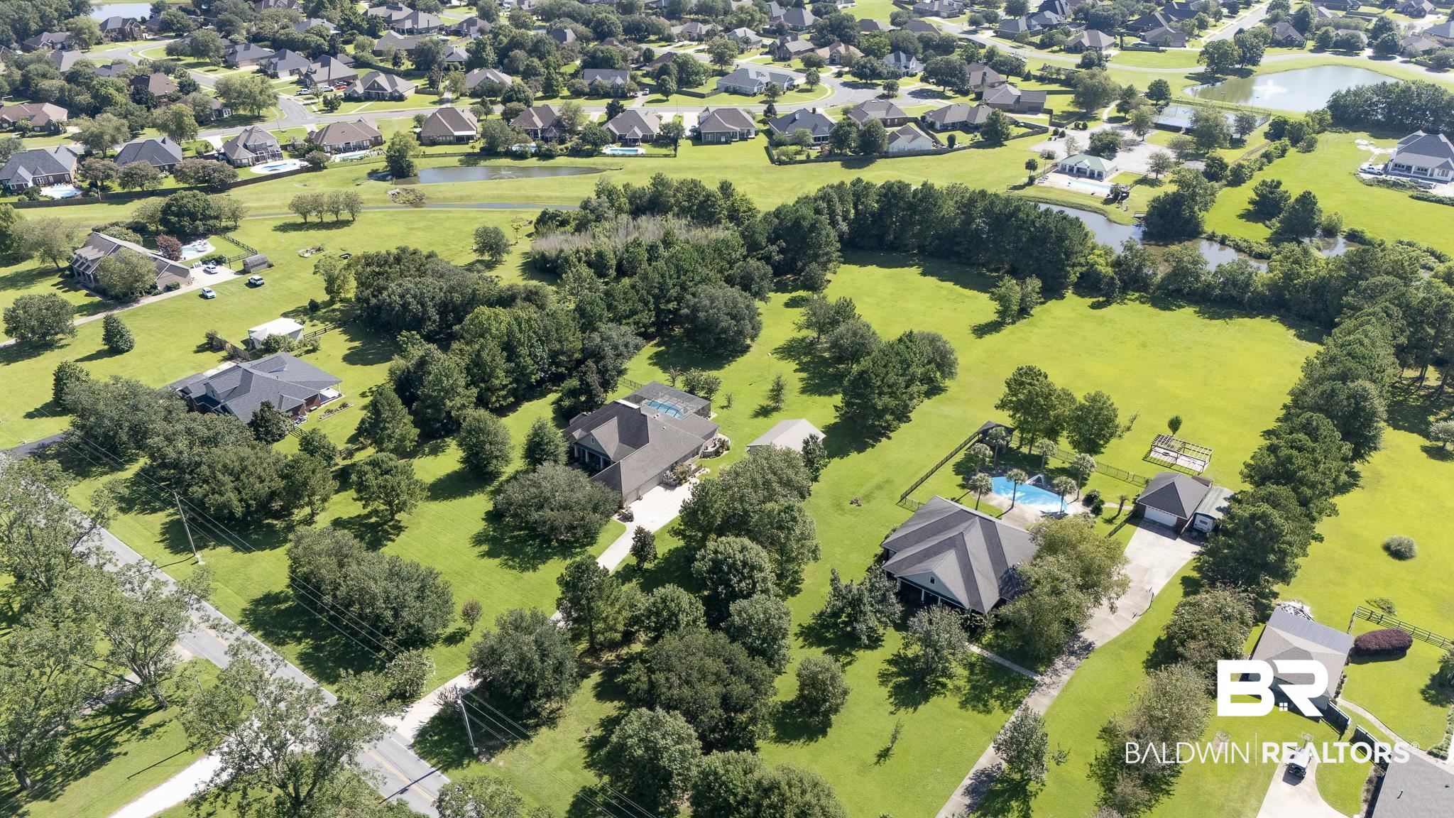 Aerial perspective of suburban area with a nearby body of water