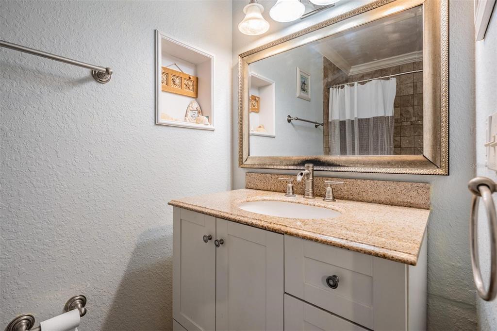 815 2nd Avenue Northwest Ruskin, FL 33570 - Photo 19 of 86 a bathroom with a granite countertop sink and a mirror