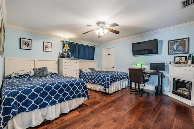 a living room with furniture and a dining table with kitchen view