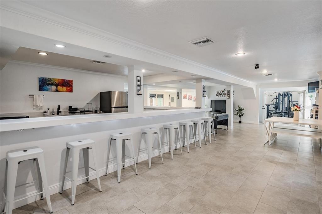 815 2nd Avenue Northwest Ruskin, FL 33570 - Photo 30 of 86 a large white kitchen with lots of counter space and breakfast area