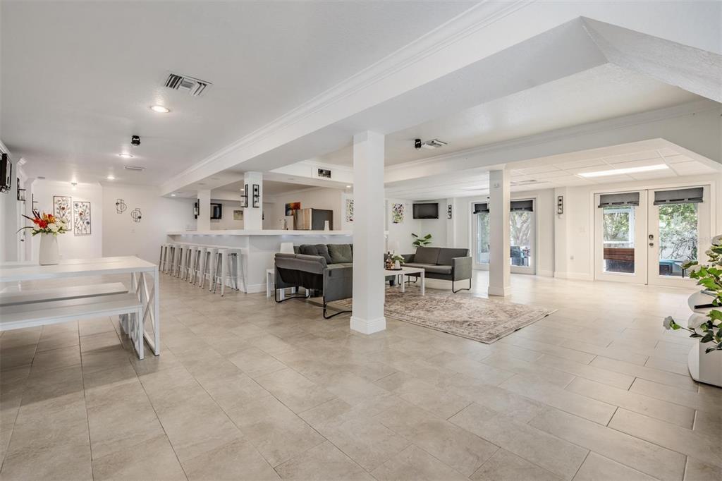815 2nd Avenue Northwest Ruskin, FL 33570 - Photo 31 of 86 a living room with furniture and a dining table with kitchen view