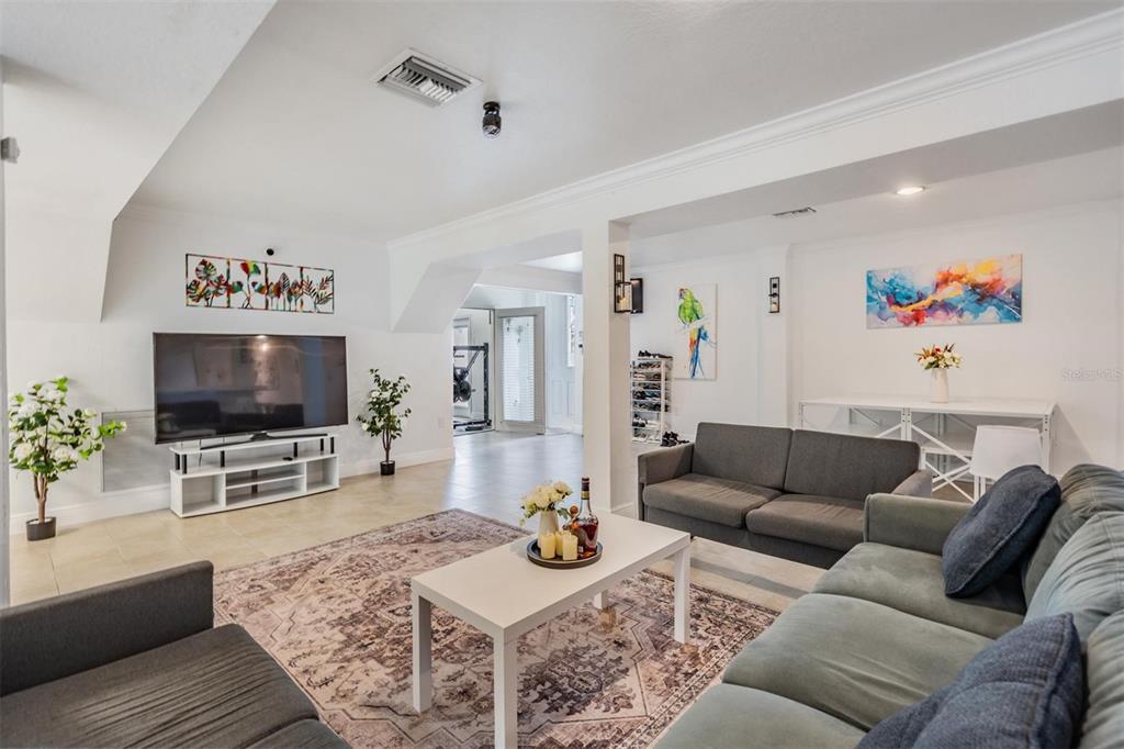 815 2nd Avenue Northwest Ruskin, FL 33570 - Photo 36 of 86 a living room with furniture and a flat screen tv