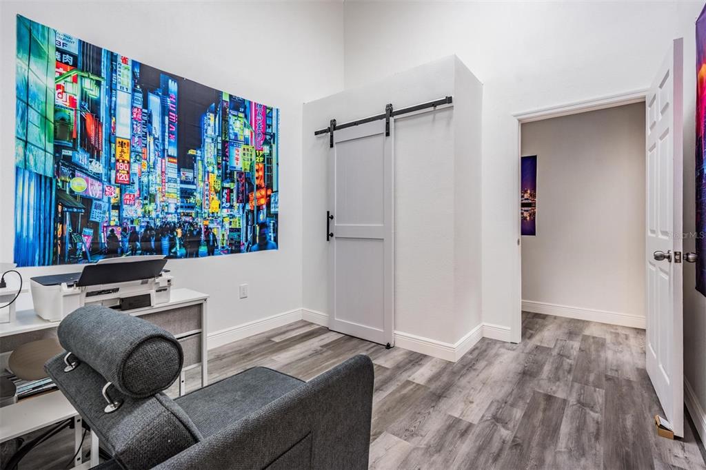 815 2nd Avenue Northwest Ruskin, FL 33570 - Photo 40 of 86 a workspace with furniture and a book shelf