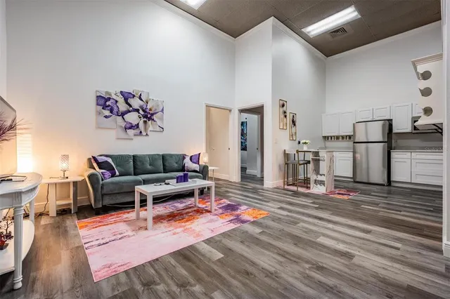 a spacious bathroom with stainless steel appliances double vanity sink and mirror