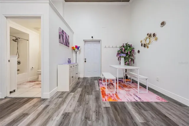 a living room with stainless steel appliances kitchen island granite countertop furniture and a view of living room