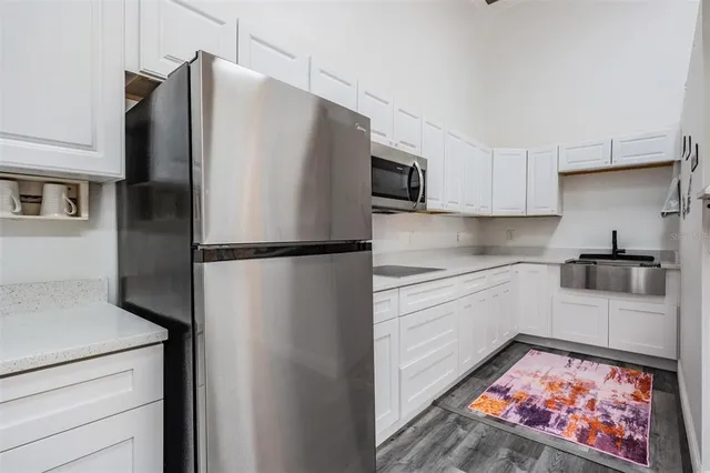a view of a backyard with large trees
