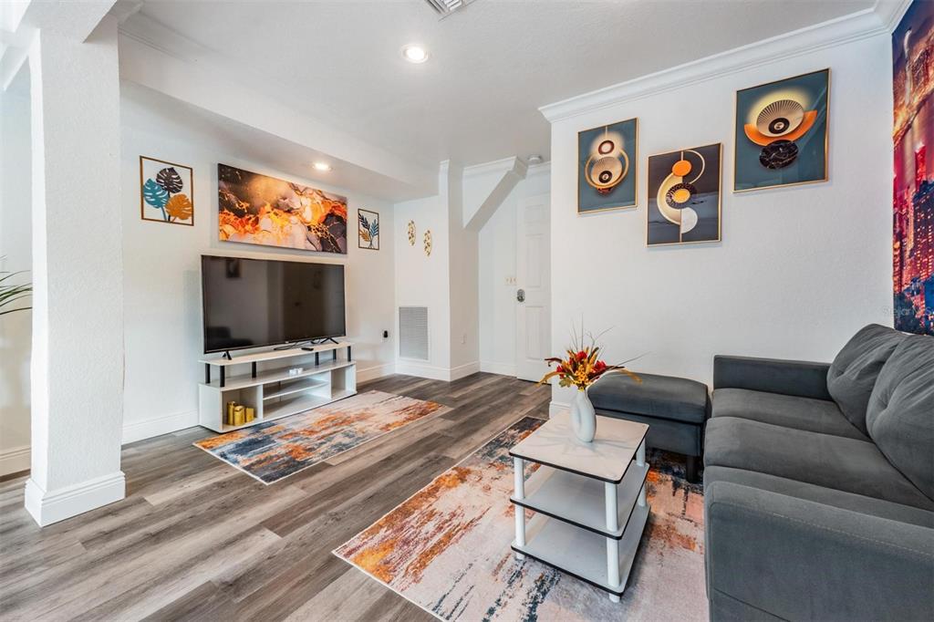 815 2nd Avenue Northwest Ruskin, FL 33570 - Photo 55 of 86 a living room with furniture and a flat screen tv