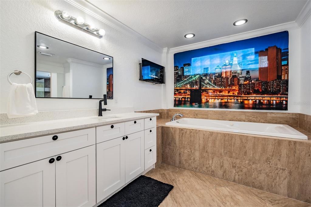 815 2nd Avenue Northwest Ruskin, FL 33570 - Photo 59 of 86 a spacious bathroom with stainless steel appliances double vanity sink and mirror