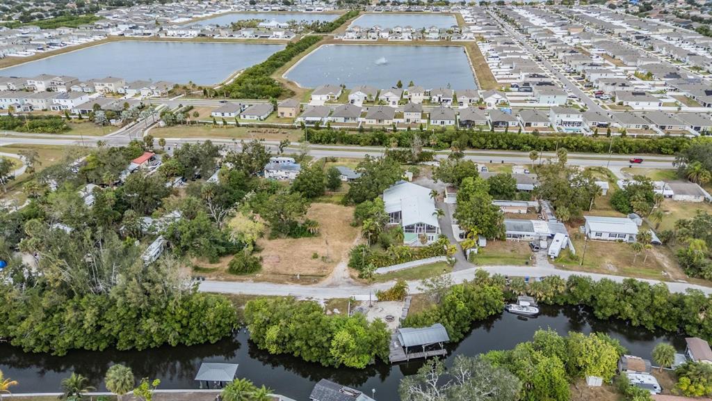 815 2nd Avenue Northwest Ruskin, FL 33570 - Photo 80 of 86 an aerial view of residential houses with outdoor space and lake view
