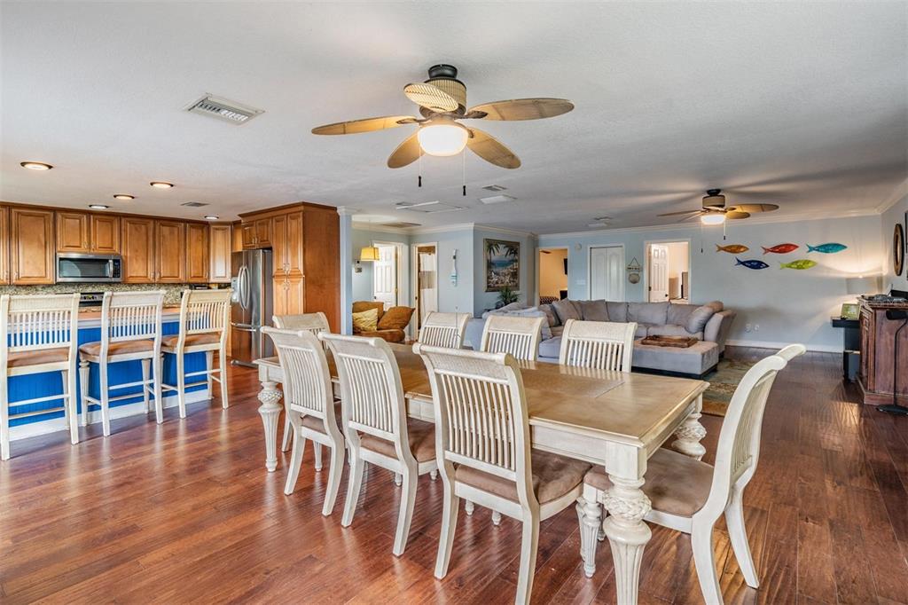 815 2nd Avenue Northwest Ruskin, FL 33570 - Photo 9 of 86 a view of a dining room with furniture and wooden floor