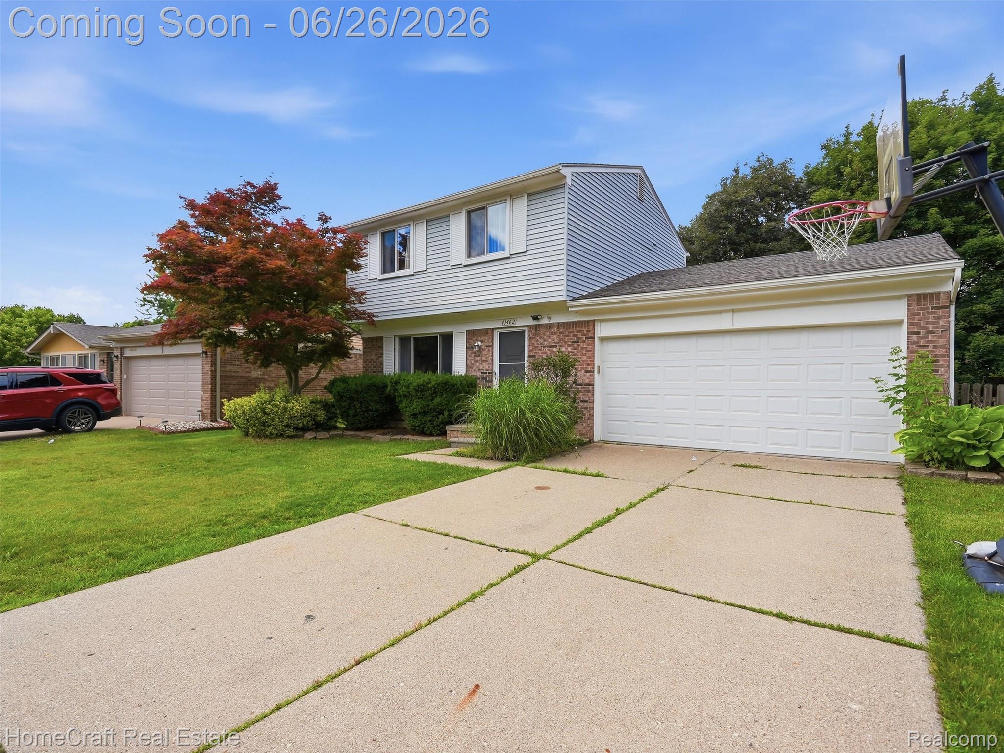41462 Simcoe Drive Canton, MI 48188 - Photo 2 of 10 Two-story residence featuring light-colored siding and brick detailing