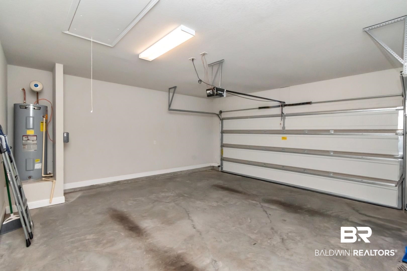 1282 Creek Ridge Court Mobile, AL 36695 - Photo 30 of 33 Garage featuring electric water heater and baseboards