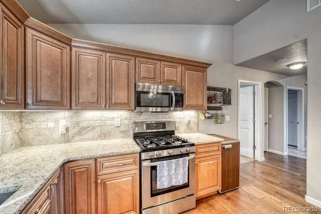 a bedroom with a bed couch and window
