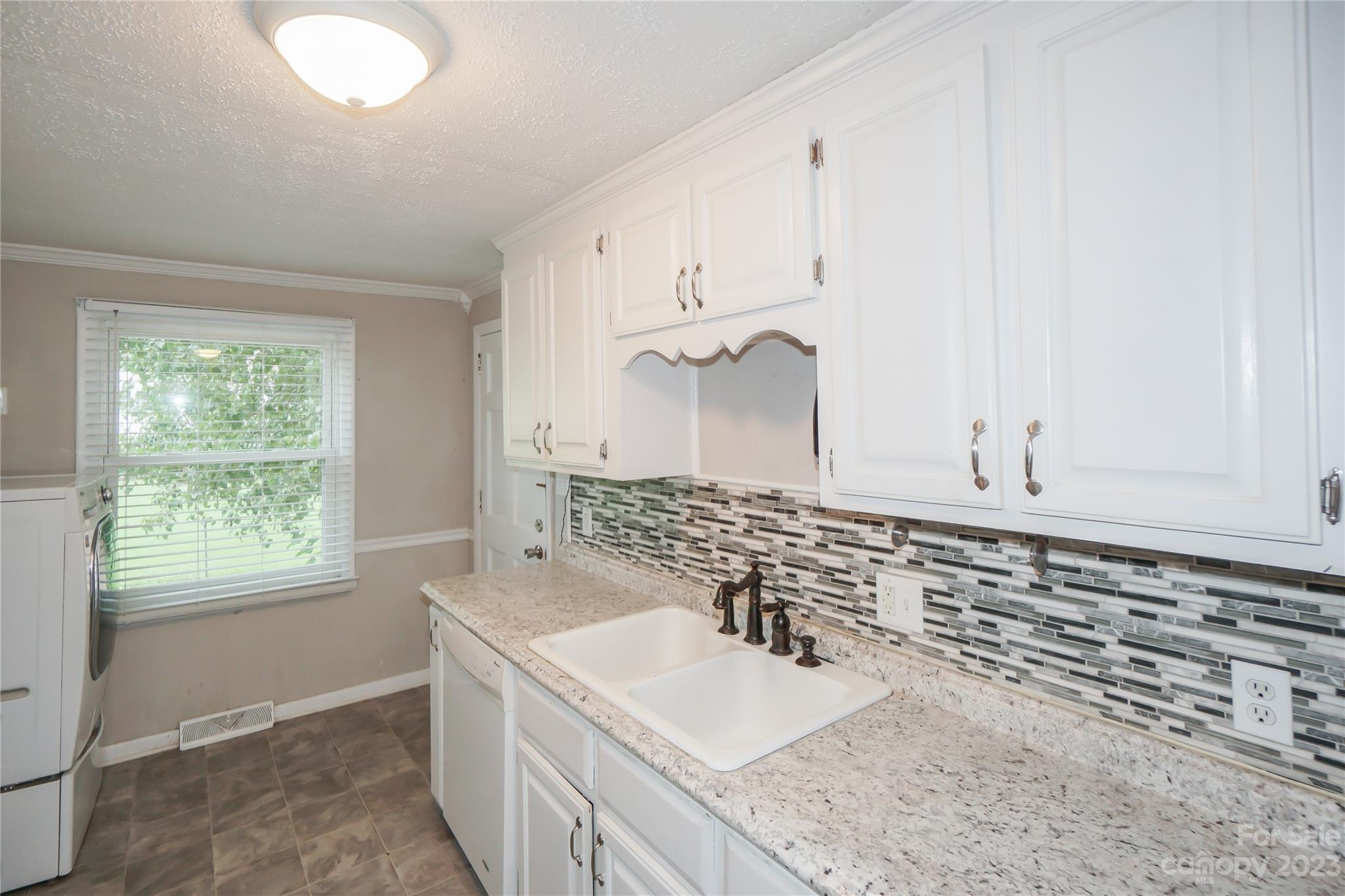 720 Flint Street Rock Hill, SC 29730 - Photo 12 of 20 a bathroom with a granite countertop sink and a vanity