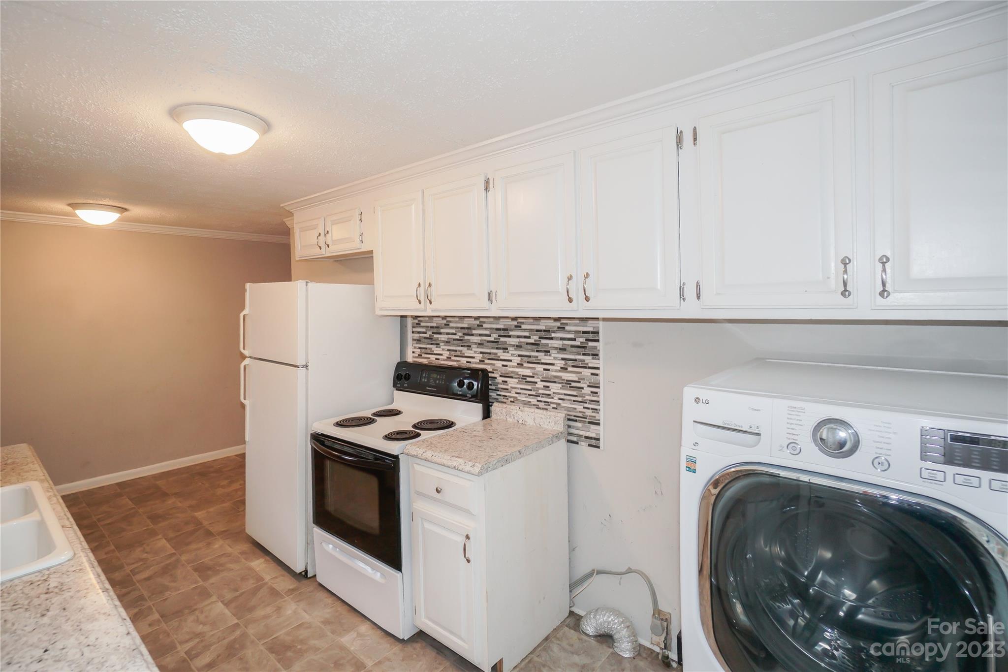 720 Flint Street Rock Hill, SC 29730 - Photo 14 of 20 a view of kitchen with washer and dryer
