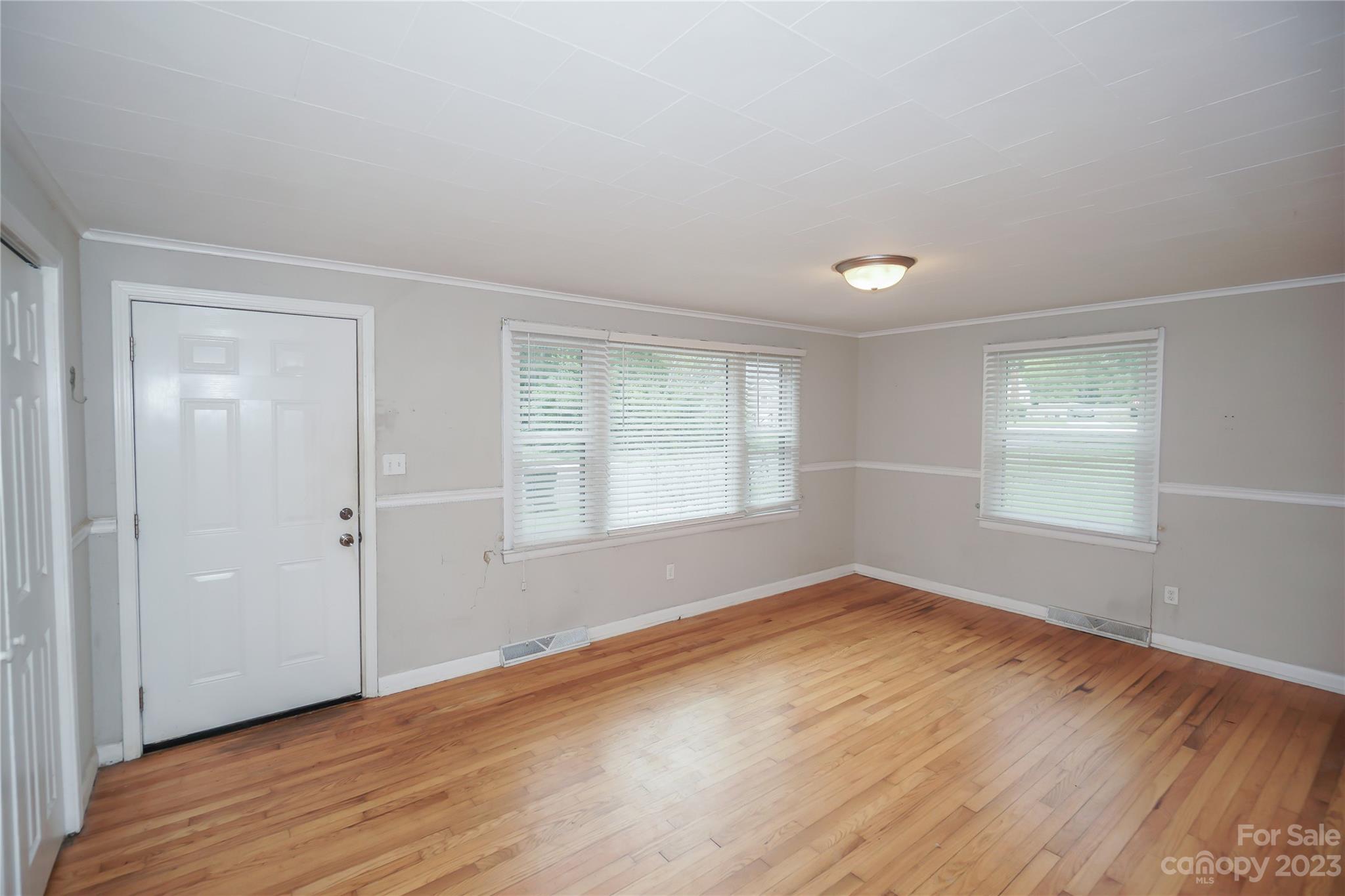 720 Flint Street Rock Hill, SC 29730 - Photo 5 of 20 a view of empty room with wooden floor and fan