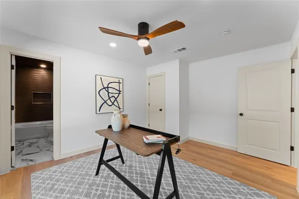 a view of a livingroom with furniture and wooden floor