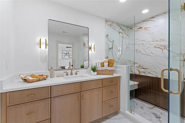 a bathroom with a sink double vanity and a mirror