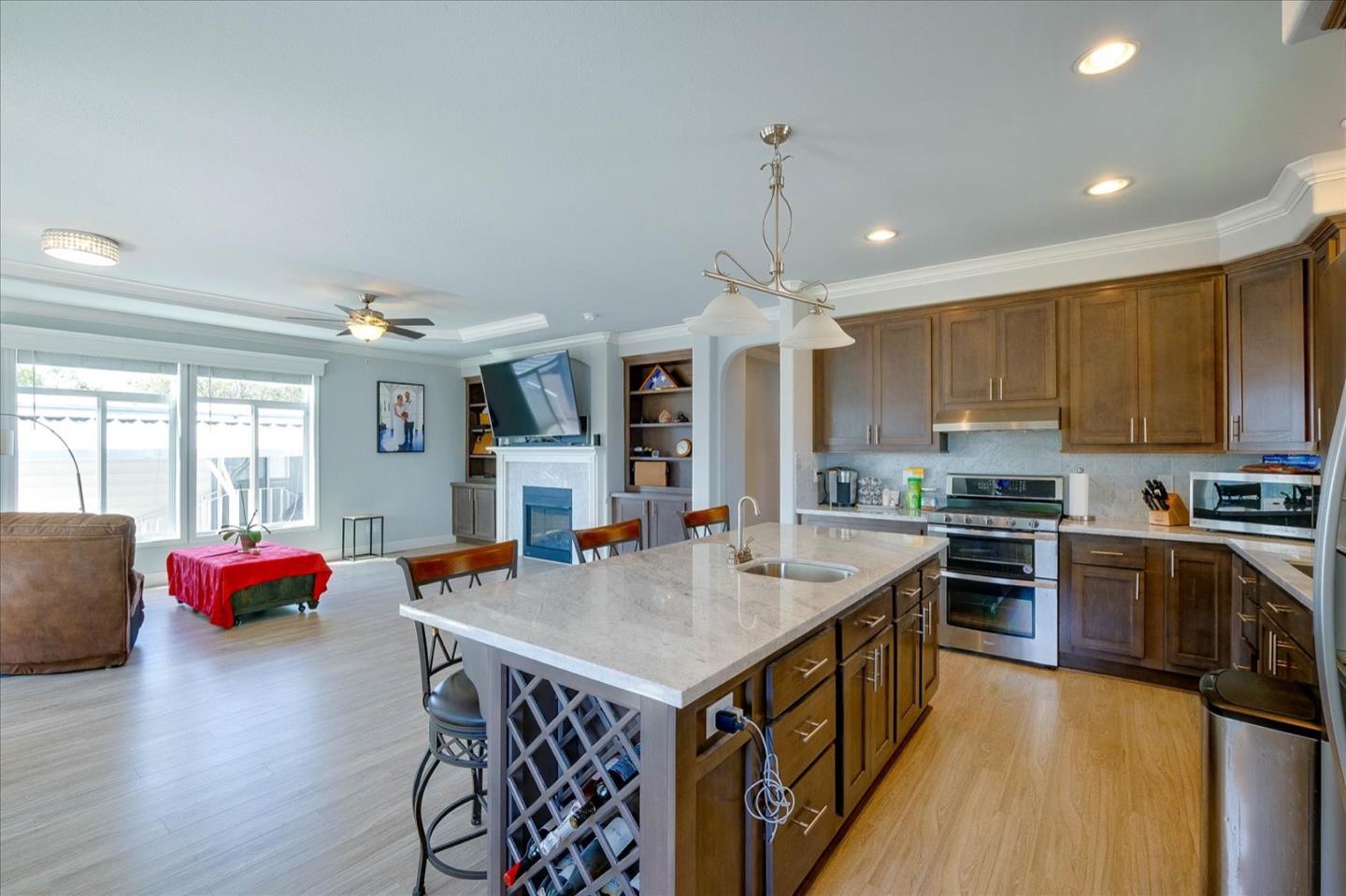 a kitchen with stainless steel appliances granite countertop a stove and refrigerator