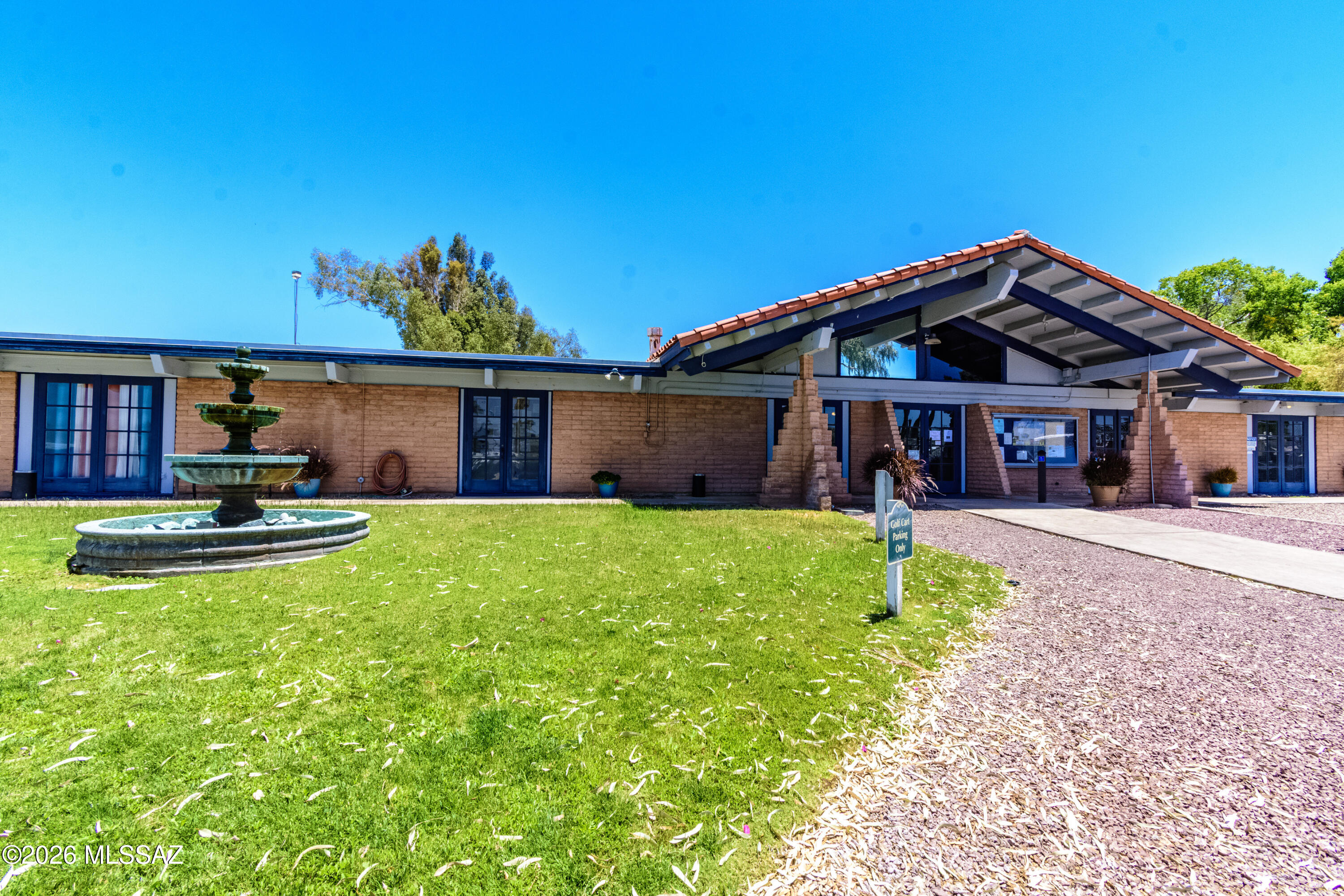 4550 North Flowing Wells Road, Unit 155 Tucson, AZ 85705 - Photo 26 of 40 a front view of a house with garden