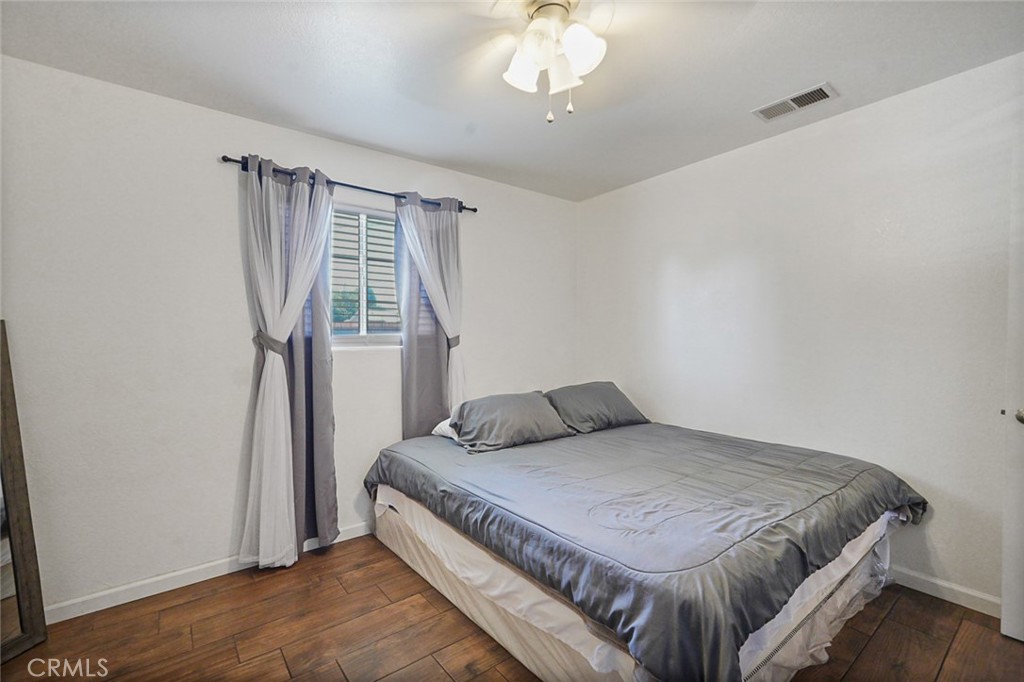 2129 Hudson Avenue Merced, CA 95348 - Photo 18 of 35 a bedroom with a bed and a window