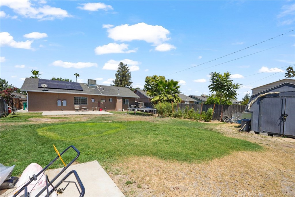 2129 Hudson Avenue Merced, CA 95348 - Photo 24 of 35 a view of a house with a backyard