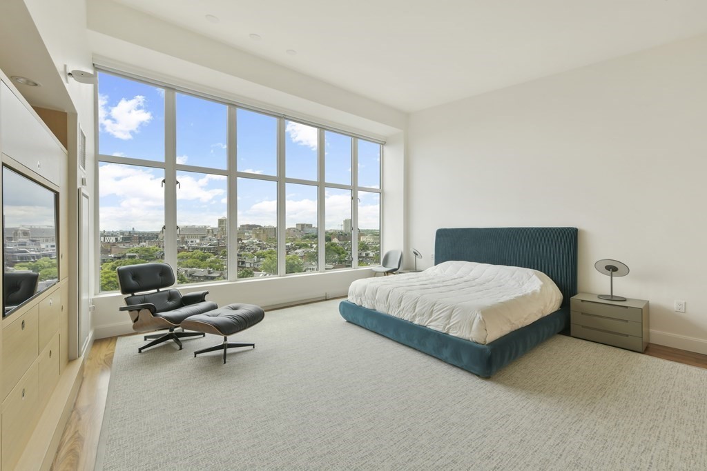 505 Tremont Street, Unit 904 Boston, MA 02116 - Photo 11 of 16 a bedroom with a bed and a large window